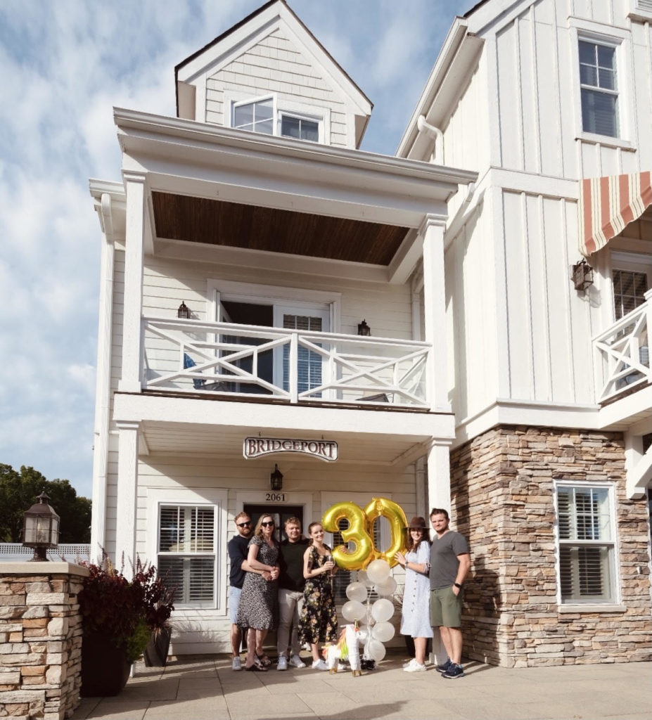 family celebrating event at the beach house at lake street in holland michigan