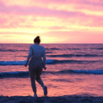 guest of the beach house at lake street enjoying the sunset on the beach at lake michigan