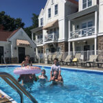 kids in swimming pool at the beach house at lake street in holland michigan
